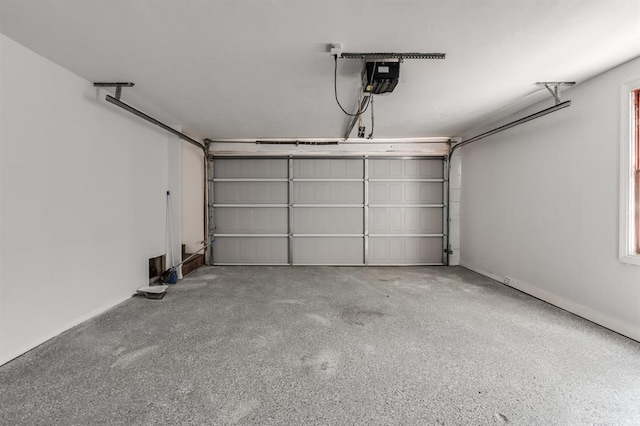 garage featuring a garage door opener