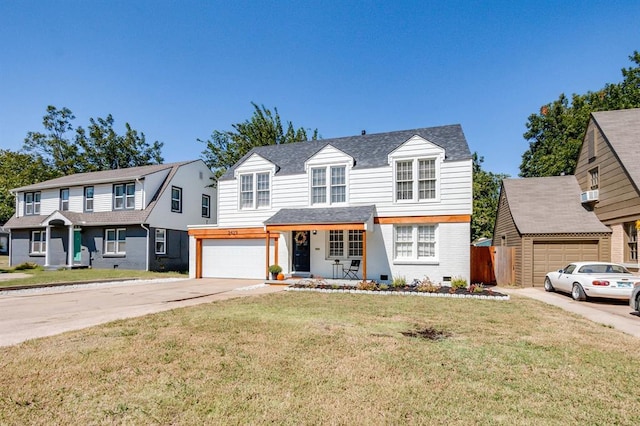 view of front of home with covered porch, a garage, and a front lawn