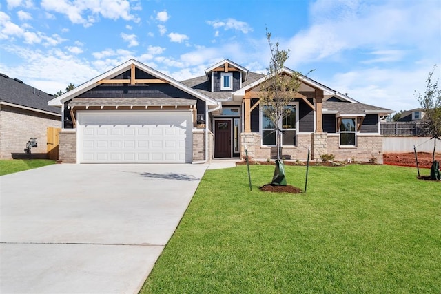 craftsman-style house featuring a front lawn and a garage