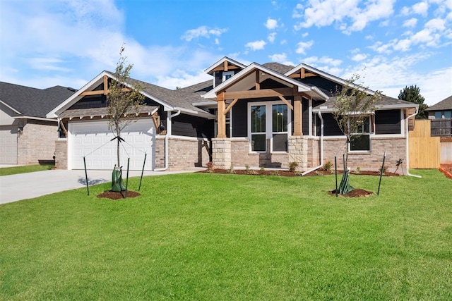 craftsman-style home with a garage and a front lawn