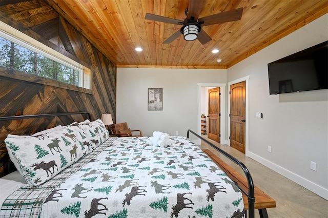 carpeted bedroom featuring ceiling fan, wooden ceiling, and wooden walls