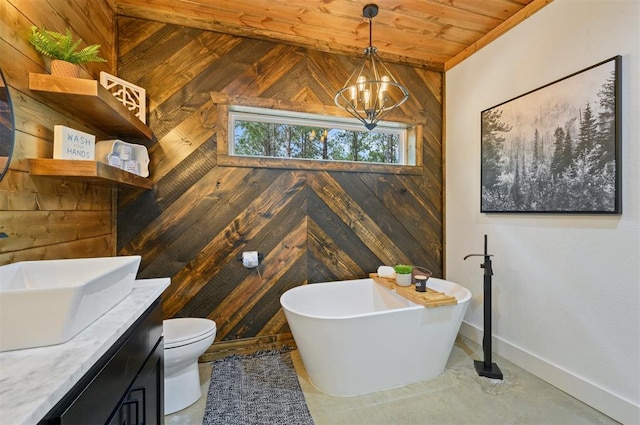 bathroom with wood walls, a washtub, a chandelier, and wooden ceiling