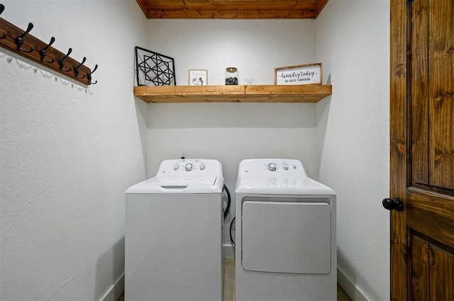 clothes washing area with washer and dryer