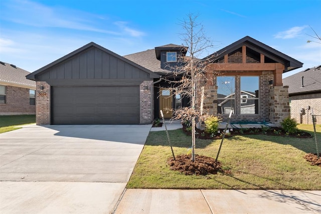 view of front of property with a garage and a front lawn