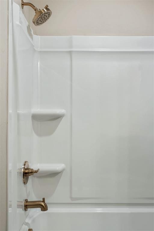 bathroom with washtub / shower combination