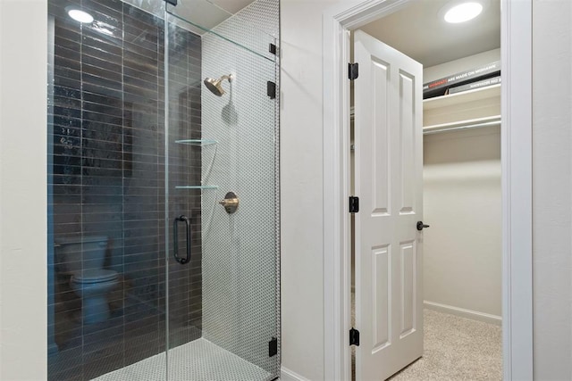 bathroom with a shower with shower door