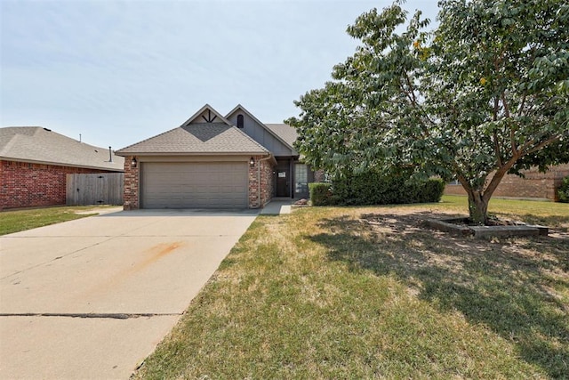 view of front facade featuring a front lawn and a garage