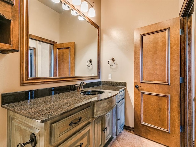 bathroom featuring tile patterned flooring and vanity