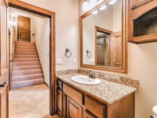 bathroom with tile patterned flooring and vanity