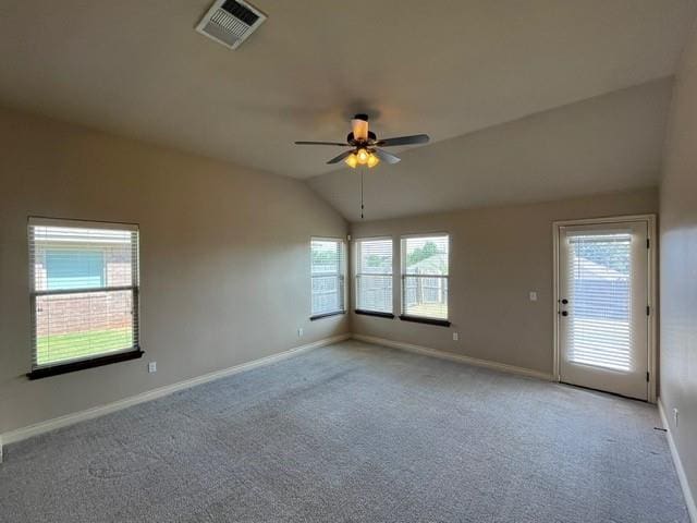 spare room with light colored carpet, ceiling fan, and lofted ceiling