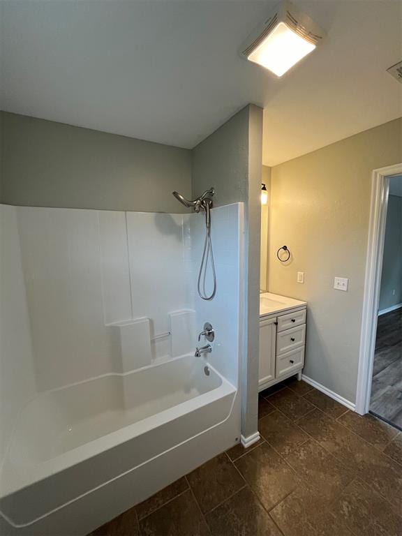 bathroom with vanity and shower / washtub combination