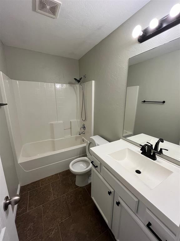 full bathroom with tile patterned flooring, vanity, toilet, and bathing tub / shower combination