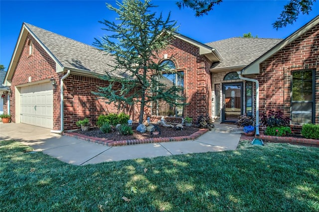 view of front of house with a garage and a front yard