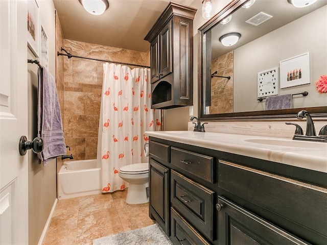 full bathroom with shower / tub combo, vanity, and toilet