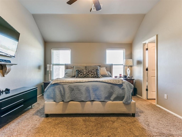 bedroom with ceiling fan, carpet floors, and vaulted ceiling