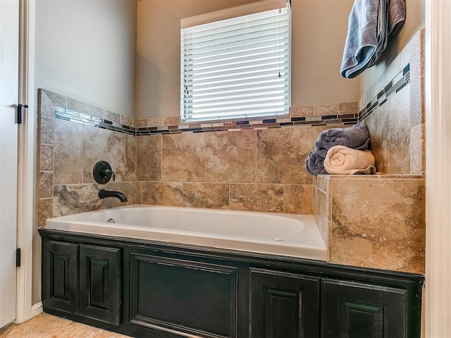 bathroom with a tub to relax in