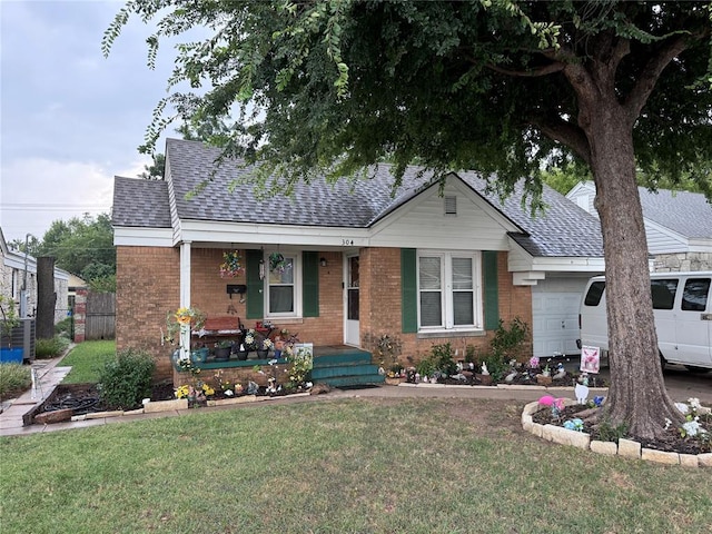 view of front facade with a front yard and a garage