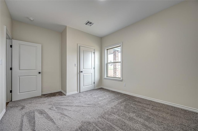 unfurnished bedroom featuring a closet and carpet