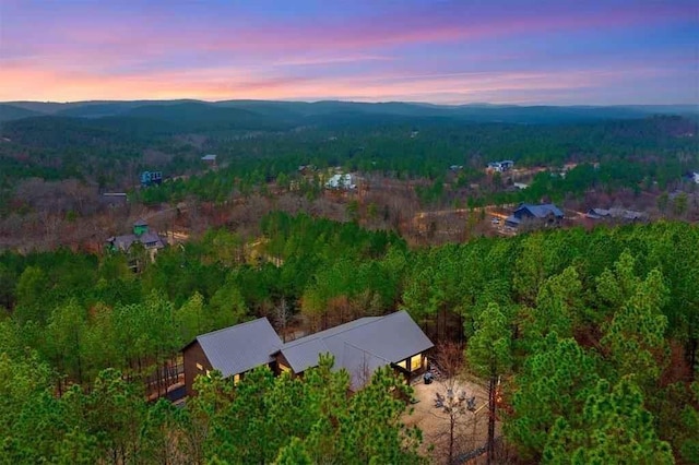 aerial view at dusk featuring a mountain view