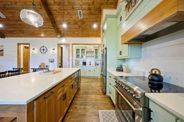 kitchen featuring custom range hood, stainless steel appliances, hardwood / wood-style flooring, wooden ceiling, and hanging light fixtures