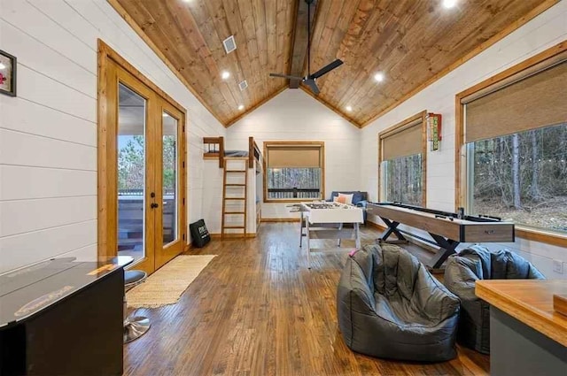 playroom featuring french doors, wood ceiling, vaulted ceiling, hardwood / wood-style flooring, and wood walls