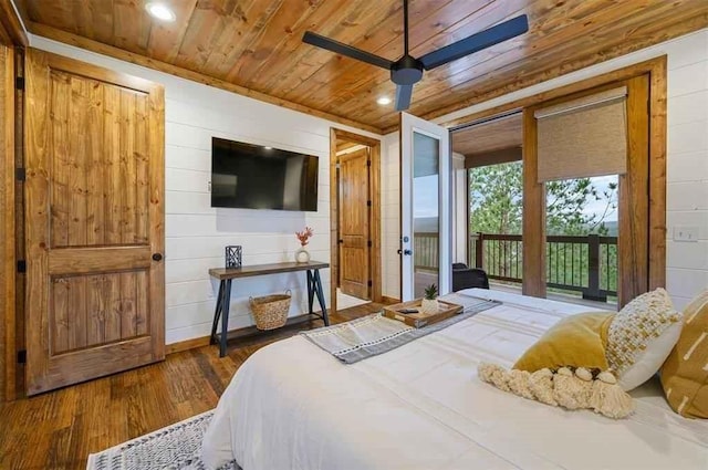 bedroom with wood walls, dark hardwood / wood-style floors, ceiling fan, and wooden ceiling