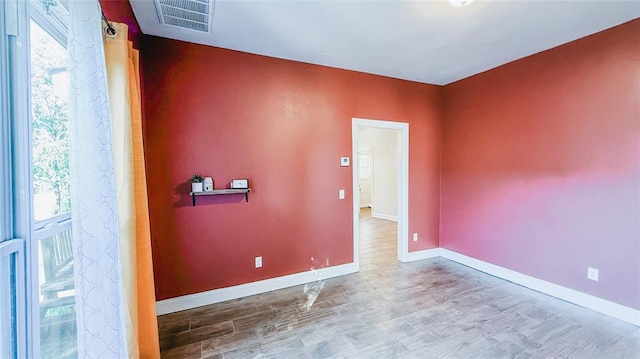 spare room featuring hardwood / wood-style flooring