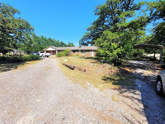 single story home with a carport