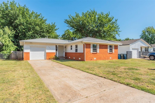 ranch-style home with a front yard and a garage