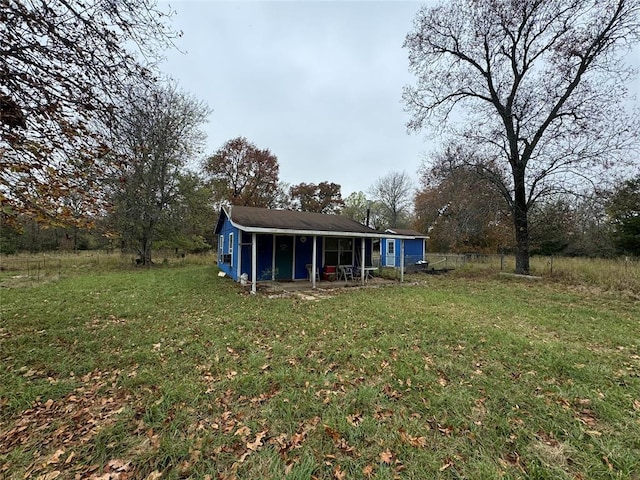 rear view of house with a lawn