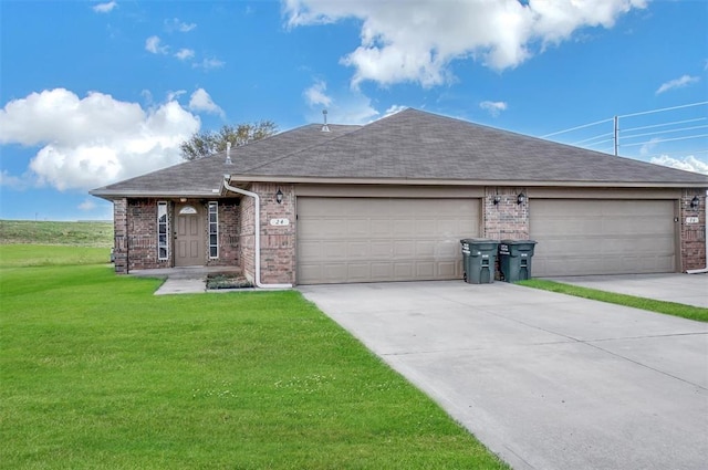 single story home featuring a front yard and a garage