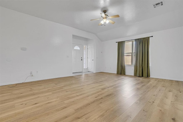 spare room featuring ceiling fan, light hardwood / wood-style flooring, and lofted ceiling