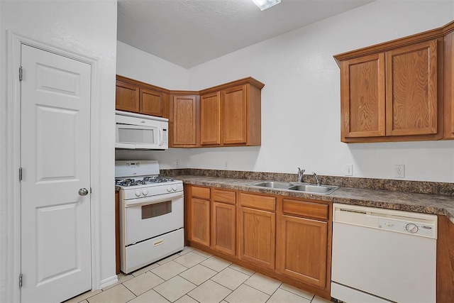 kitchen featuring sink and white appliances