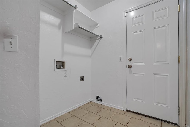 laundry area featuring washer hookup, electric dryer hookup, and light tile patterned flooring