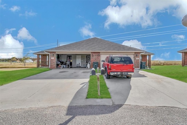 ranch-style home featuring a garage and a front lawn