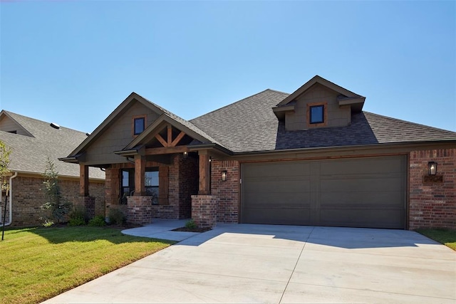 view of front facade featuring a garage and a front lawn