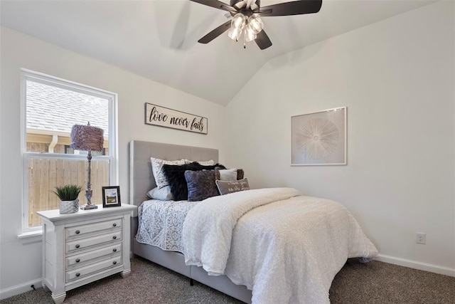 carpeted bedroom with vaulted ceiling and ceiling fan