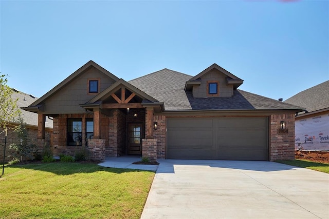 craftsman-style home featuring a garage and a front yard