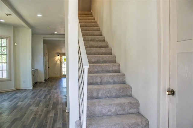 stairs with wood-type flooring