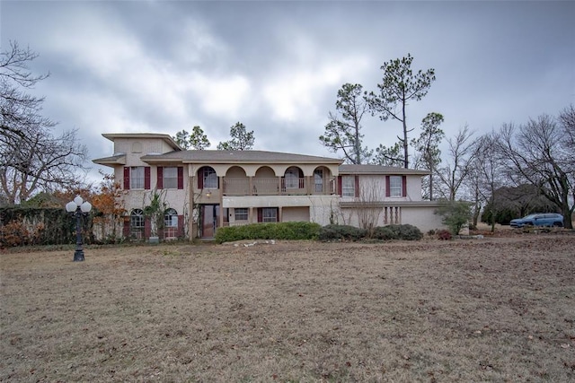 view of front of home with a balcony