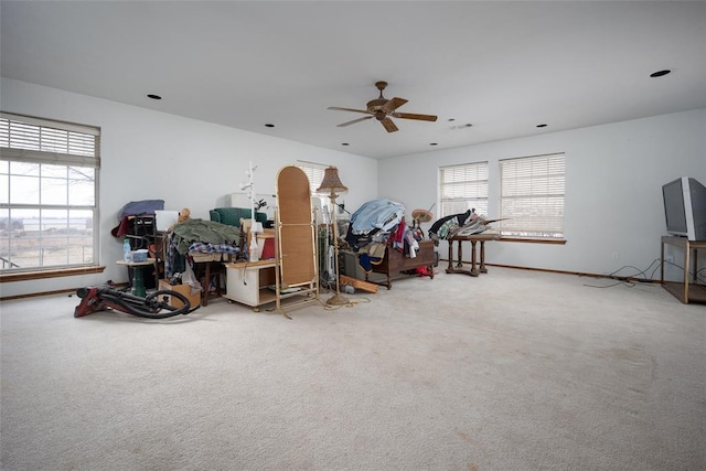 misc room with plenty of natural light, carpet flooring, and ceiling fan