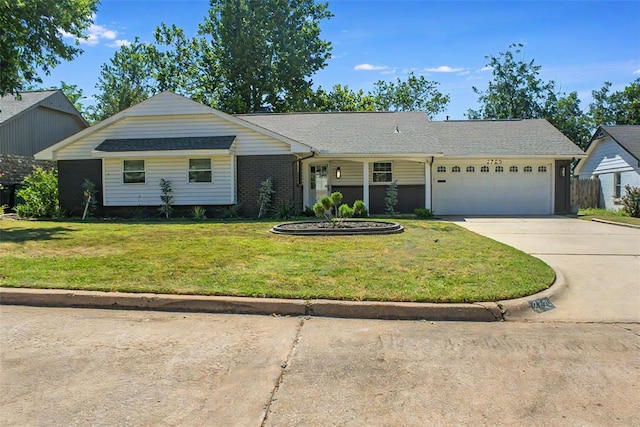 ranch-style house with a garage and a front lawn