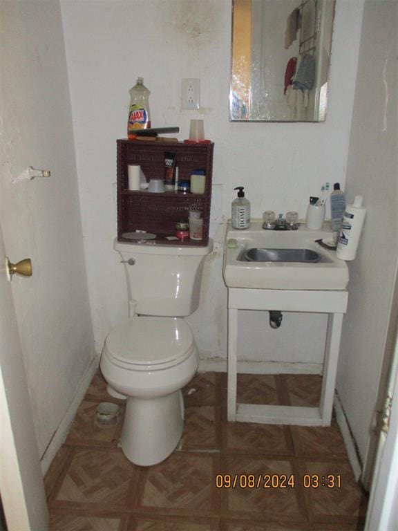 bathroom with sink and toilet