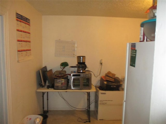 interior space featuring a textured ceiling and water heater