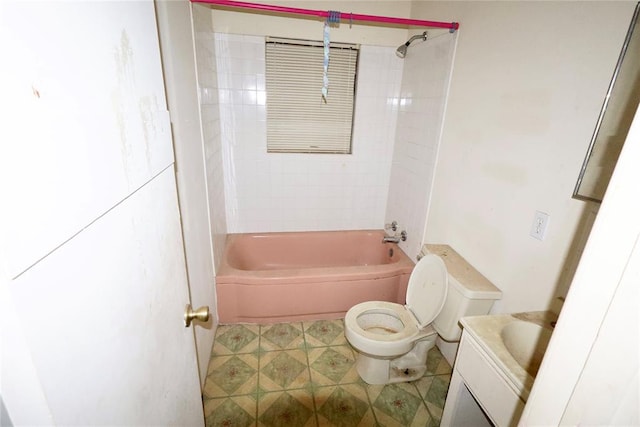 full bathroom featuring toilet, vanity, and tiled shower / bath