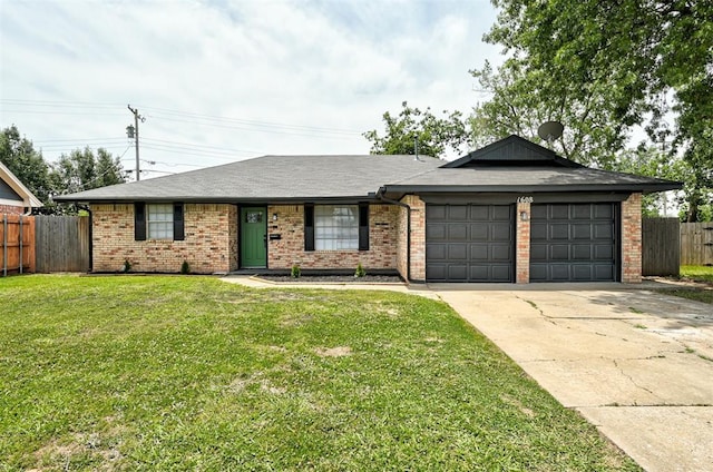 ranch-style home featuring a front yard and a garage