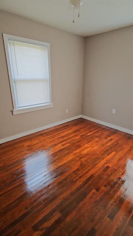 empty room featuring dark hardwood / wood-style flooring