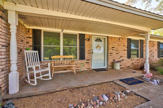 property entrance with covered porch