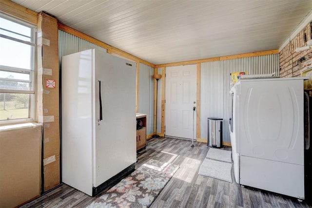 laundry room featuring hardwood / wood-style floors and washer / clothes dryer