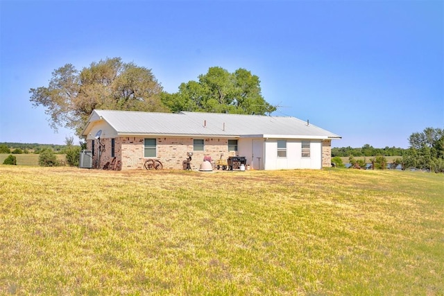 back of house with a yard